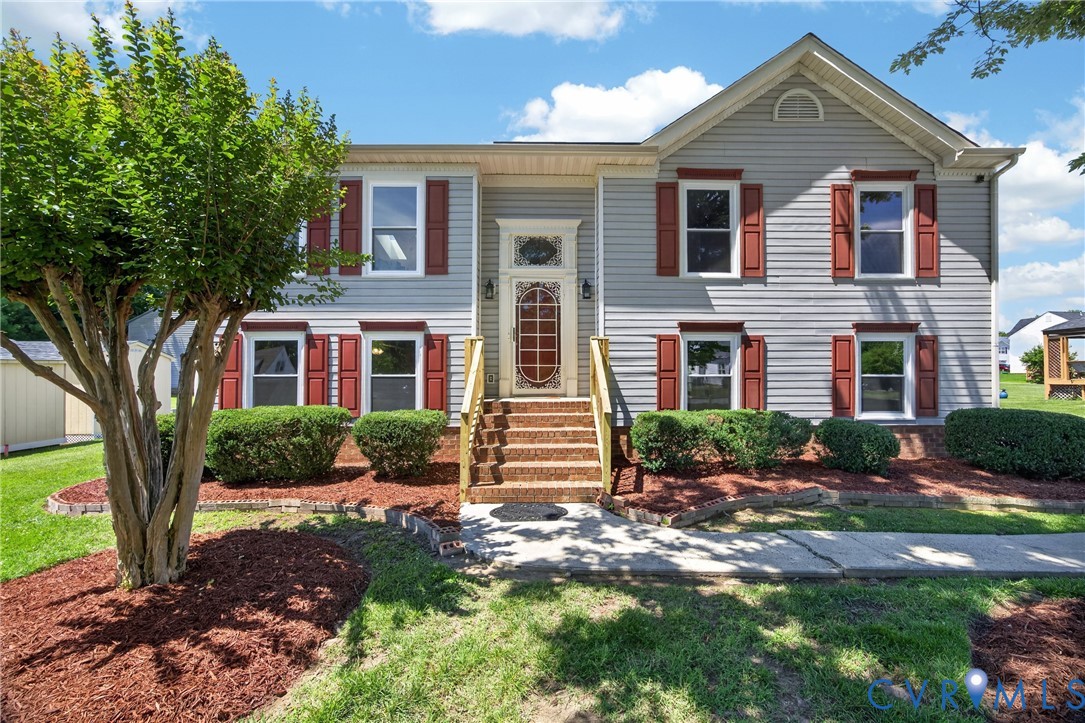 1559 Tree Ridge Road Henrico, VA 23231 - Photo 1 of 40 Two-story residence featuring light gray siding wi