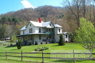 116 Ira Powers Road Lansing, NC 28643 - Photo 1 of 1 a front view of a house with garden