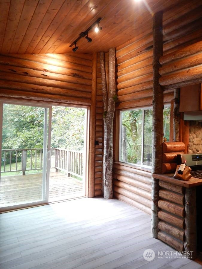51614 South Riverside Road Gold Bar, WA 98251 - Photo 17 of 37 a view of a room with wooden floor and stairs
