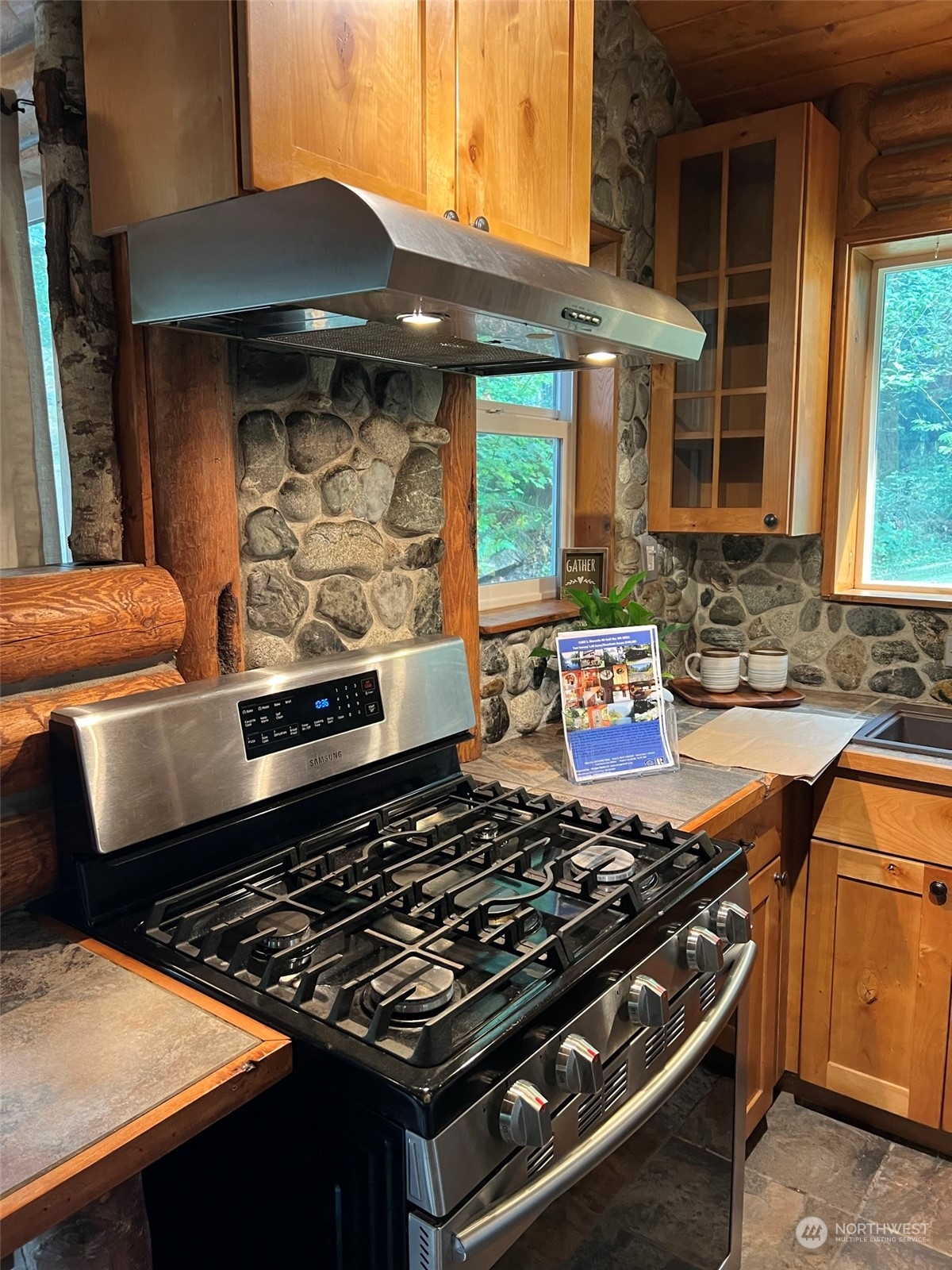 51614 South Riverside Road Gold Bar, WA 98251 - Photo 28 of 37 a stove top oven sitting inside of a kitchen