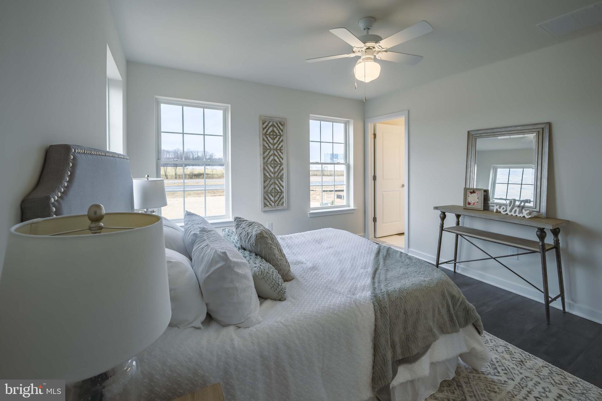 541 Ruth Way Dover, DE 19904 - Photo 9 of 10 a bed sitting in a bedroom next to a window