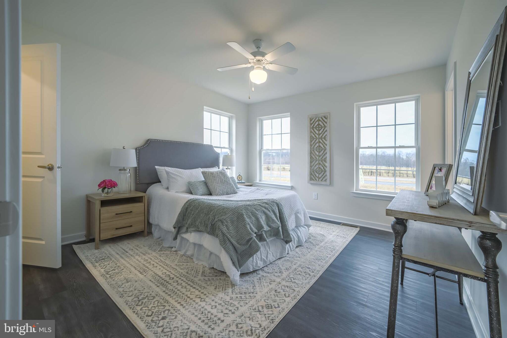 541 Ruth Way Dover, DE 19904 - Photo 10 of 10 a spacious bedroom with a bed and wooden floor