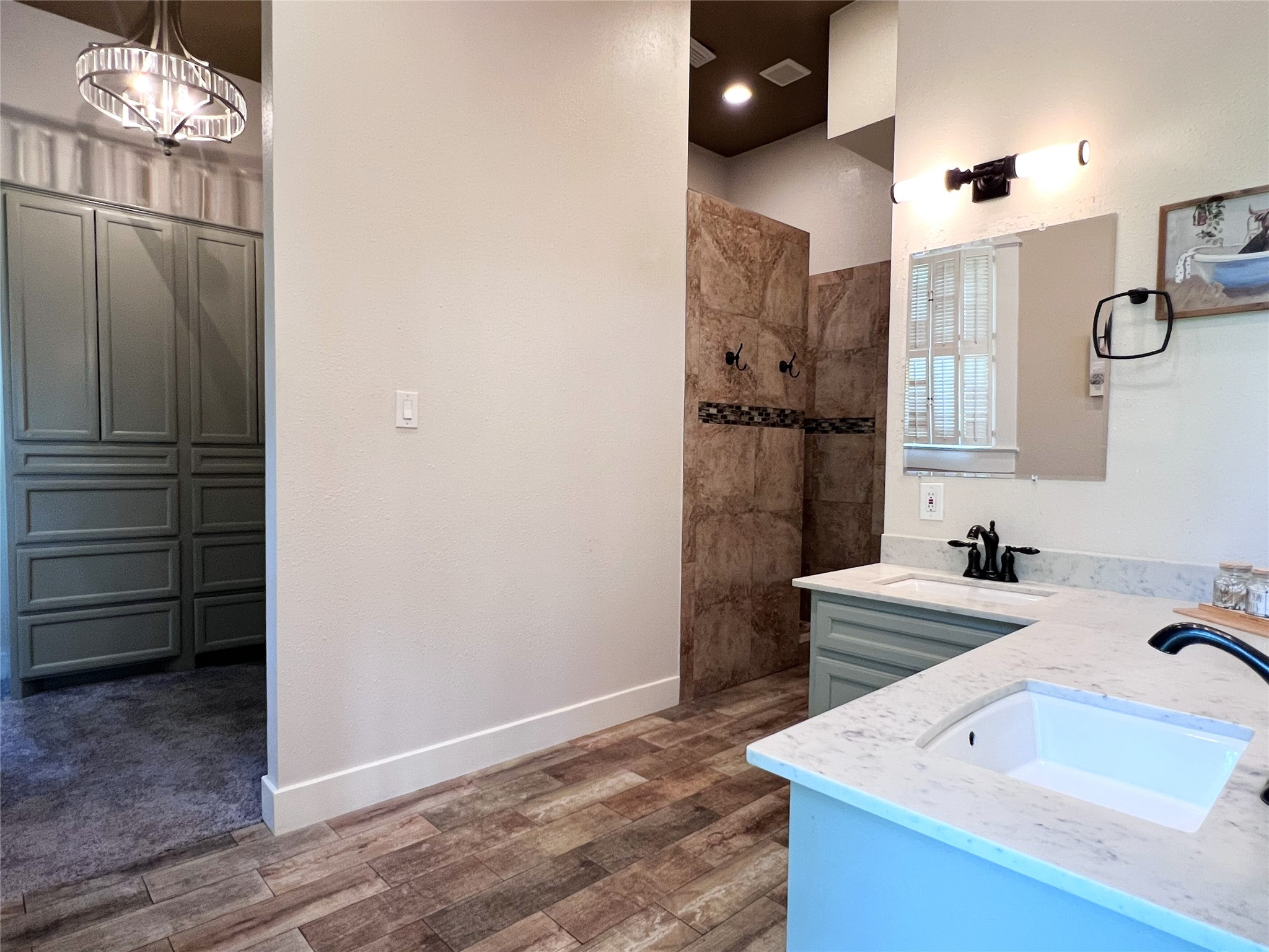 606 Sycamore Street Brenham, TX 77833 - Photo 10 of 27 a bathroom with a sink and a mirror