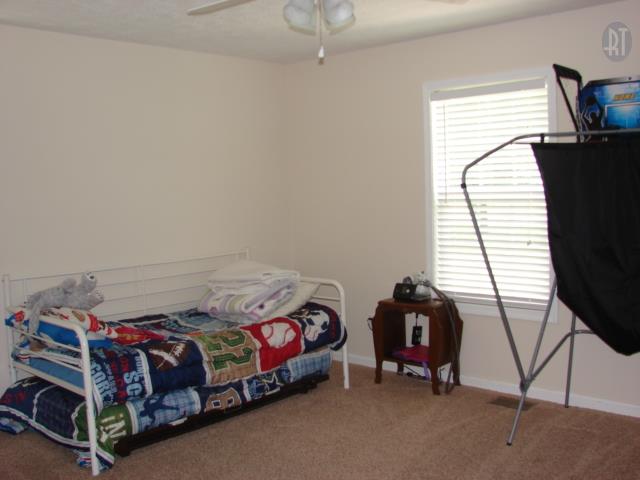 1200 Mt Vernon Road Bethpage, TN 37022 - Photo 3 of 12 a bedroom with a bed and a window