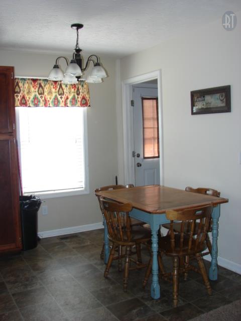 1200 Mt Vernon Road Bethpage, TN 37022 - Photo 5 of 12 a view of a dining room with furniture window and wooden floor
