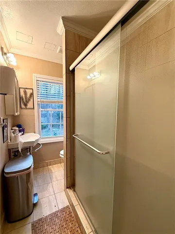 a bathroom with a bathtub and a shower