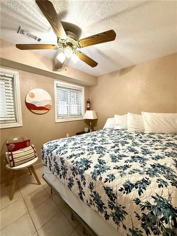 a bedroom with a bed and dresser