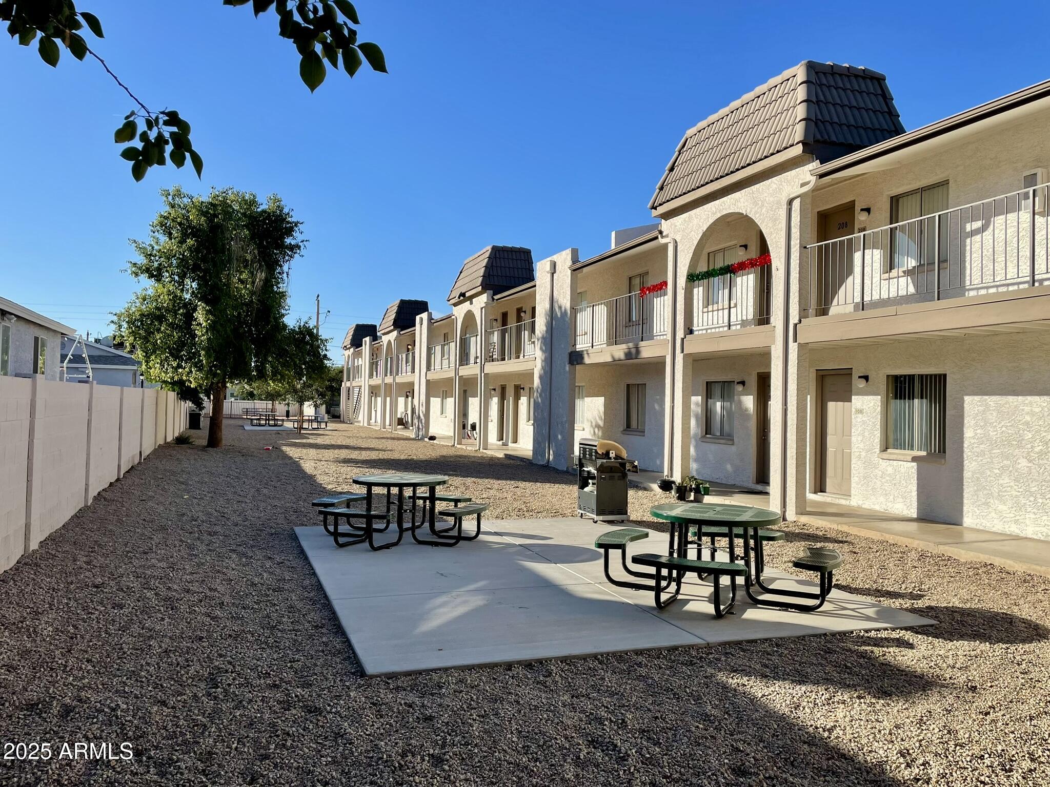 1222 East Mountain View Road, Unit 208 Phoenix, AZ 85020 - Photo 22 of 24 a view of a building with sitting area
