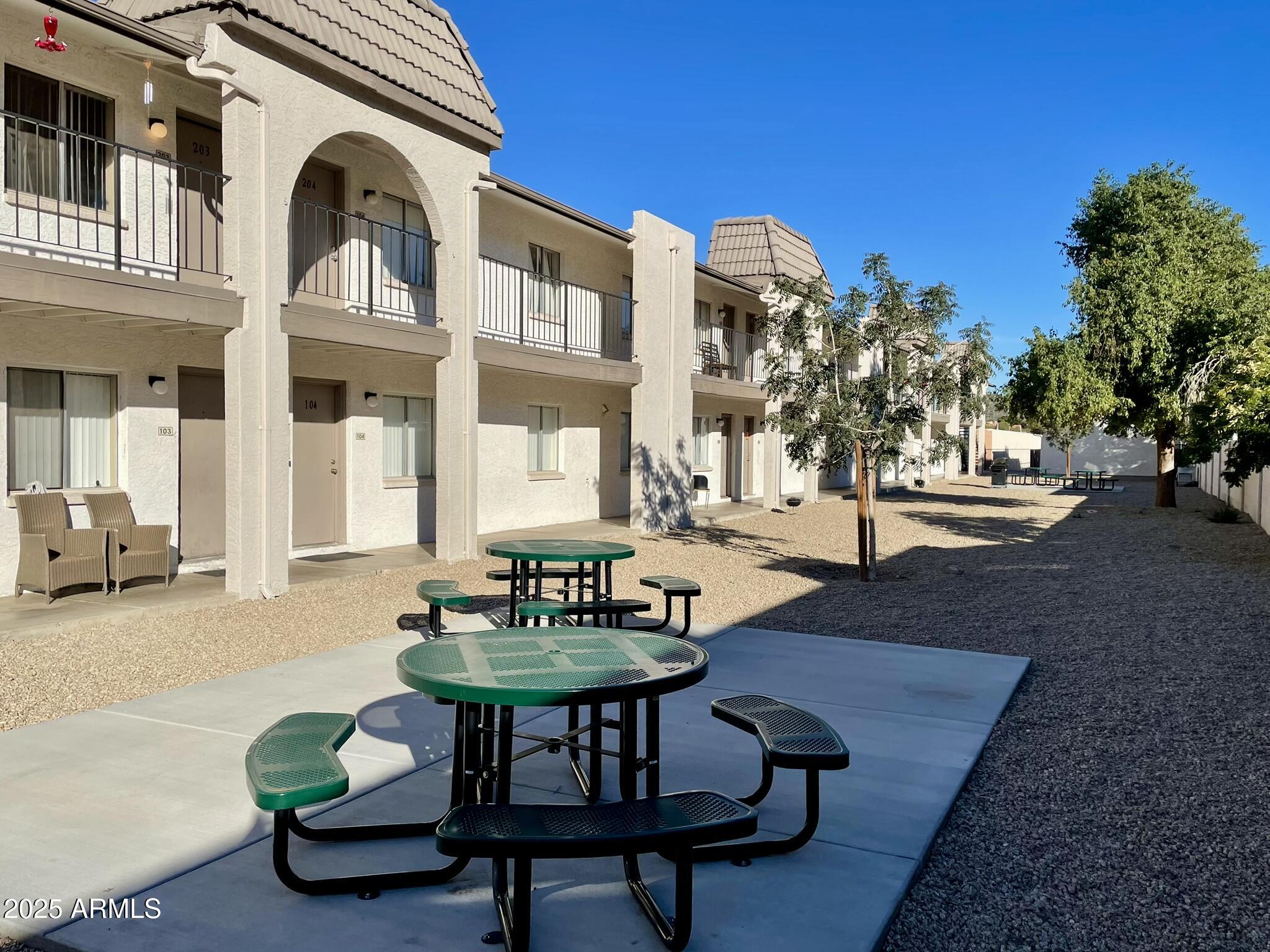 1222 East Mountain View Road, Unit 208 Phoenix, AZ 85020 - Photo 23 of 24 a outdoor living room with furniture and a potted plant