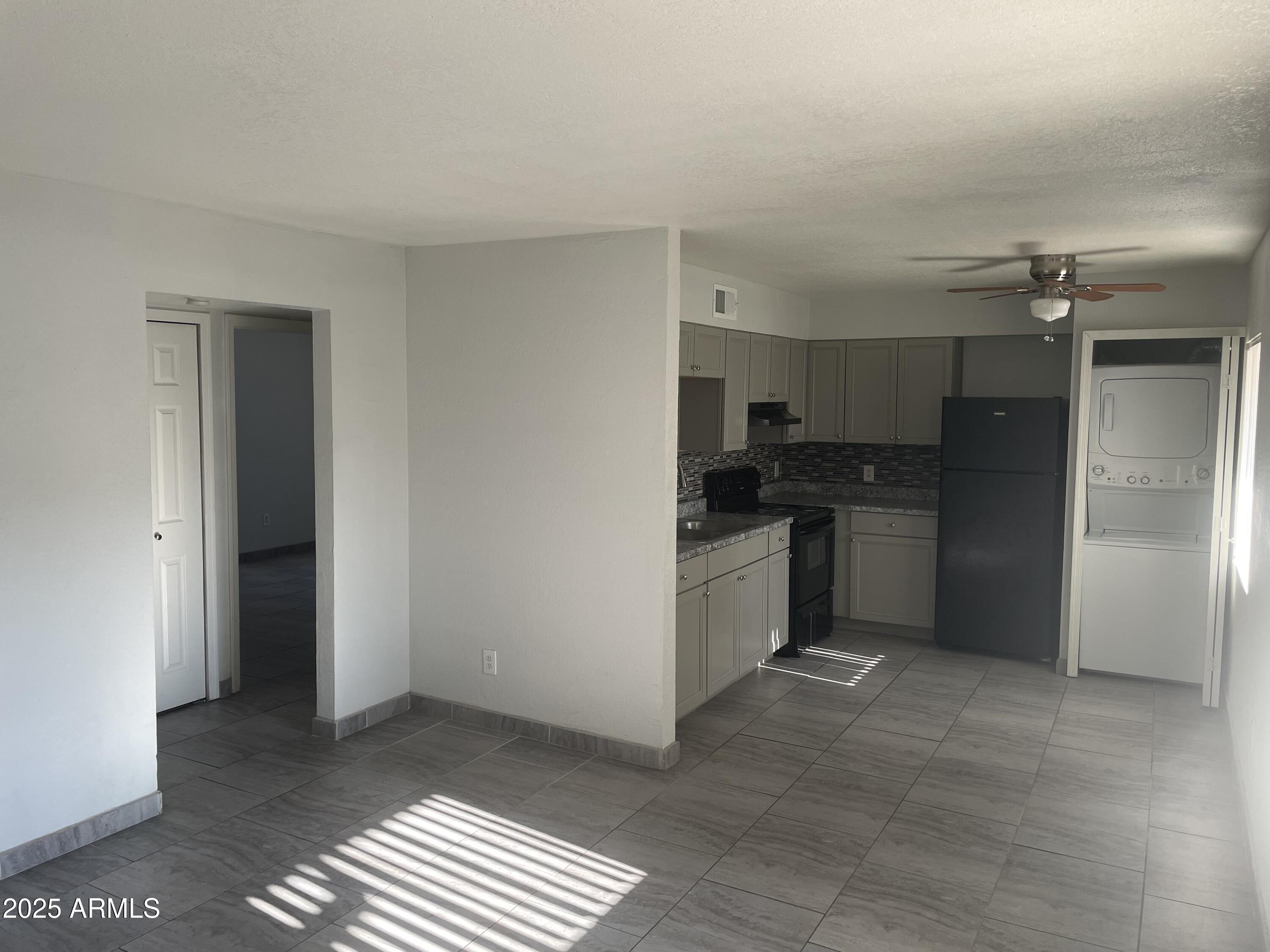 1222 East Mountain View Road, Unit 208 Phoenix, AZ 85020 - Photo 5 of 24 a kitchen with a refrigerator and a sink