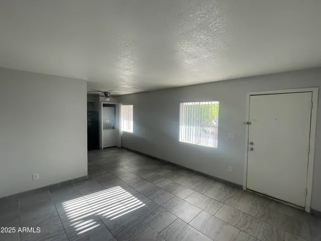 a view of an empty room and window
