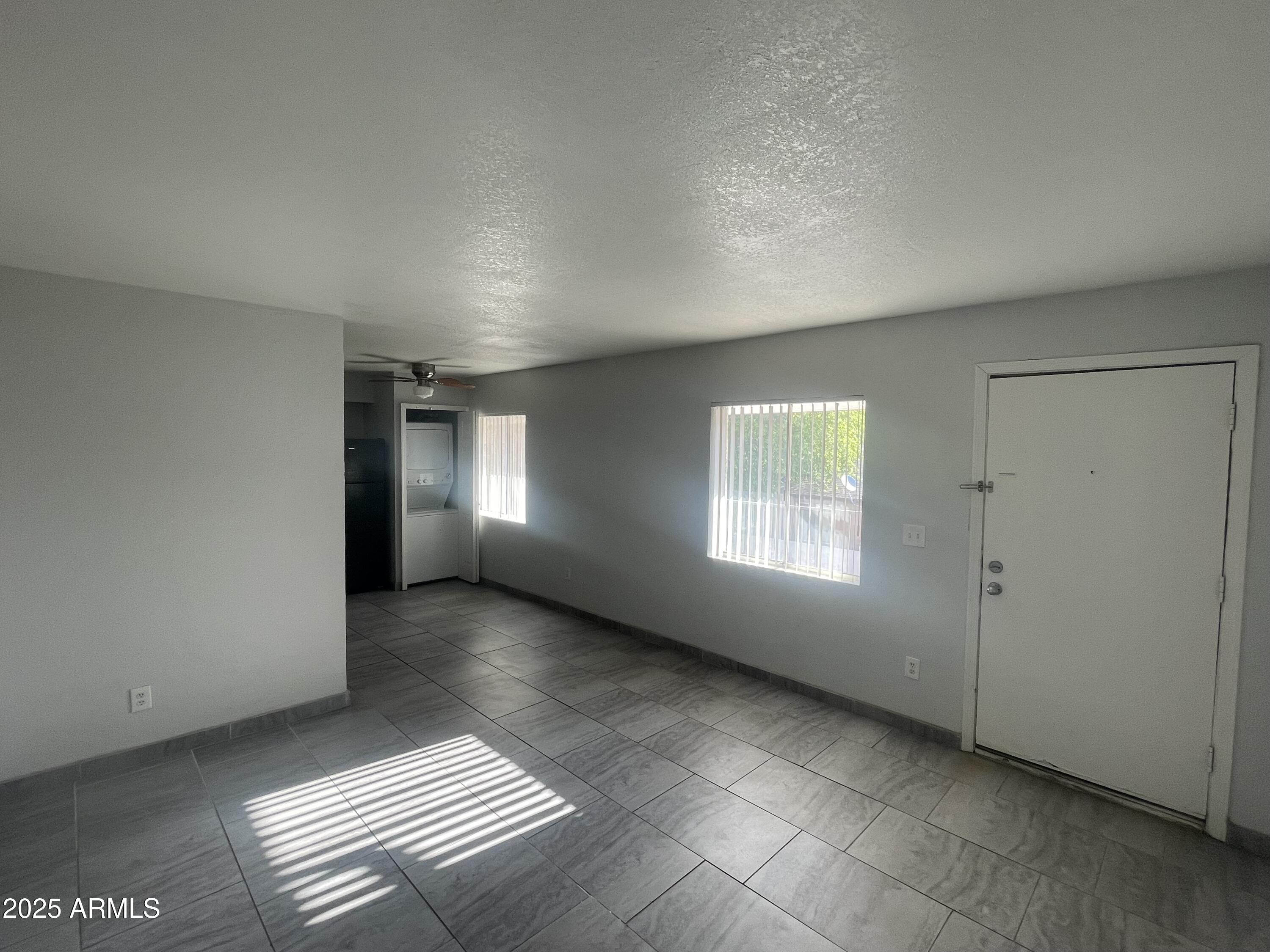 1222 East Mountain View Road, Unit 208 Phoenix, AZ 85020 - Photo 6 of 24 a view of an empty room and window