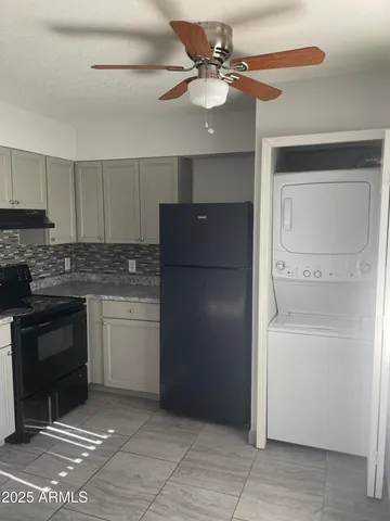a kitchen with a refrigerator a sink and dishwasher
