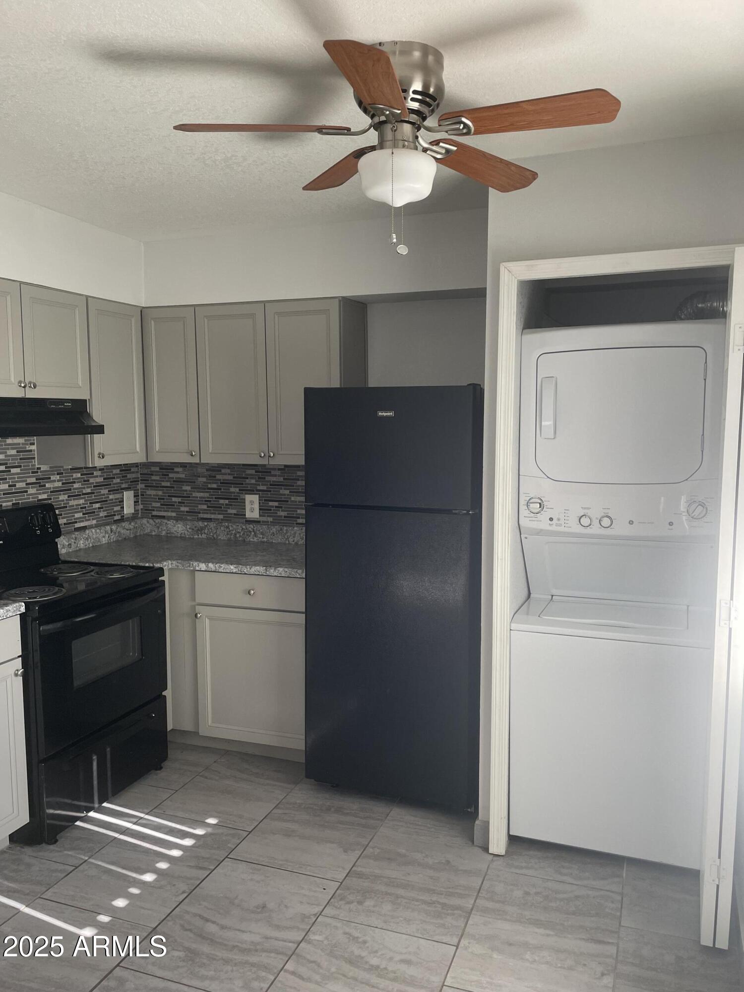 1222 East Mountain View Road, Unit 208 Phoenix, AZ 85020 - Photo 8 of 24 a kitchen with a refrigerator a sink and dishwasher