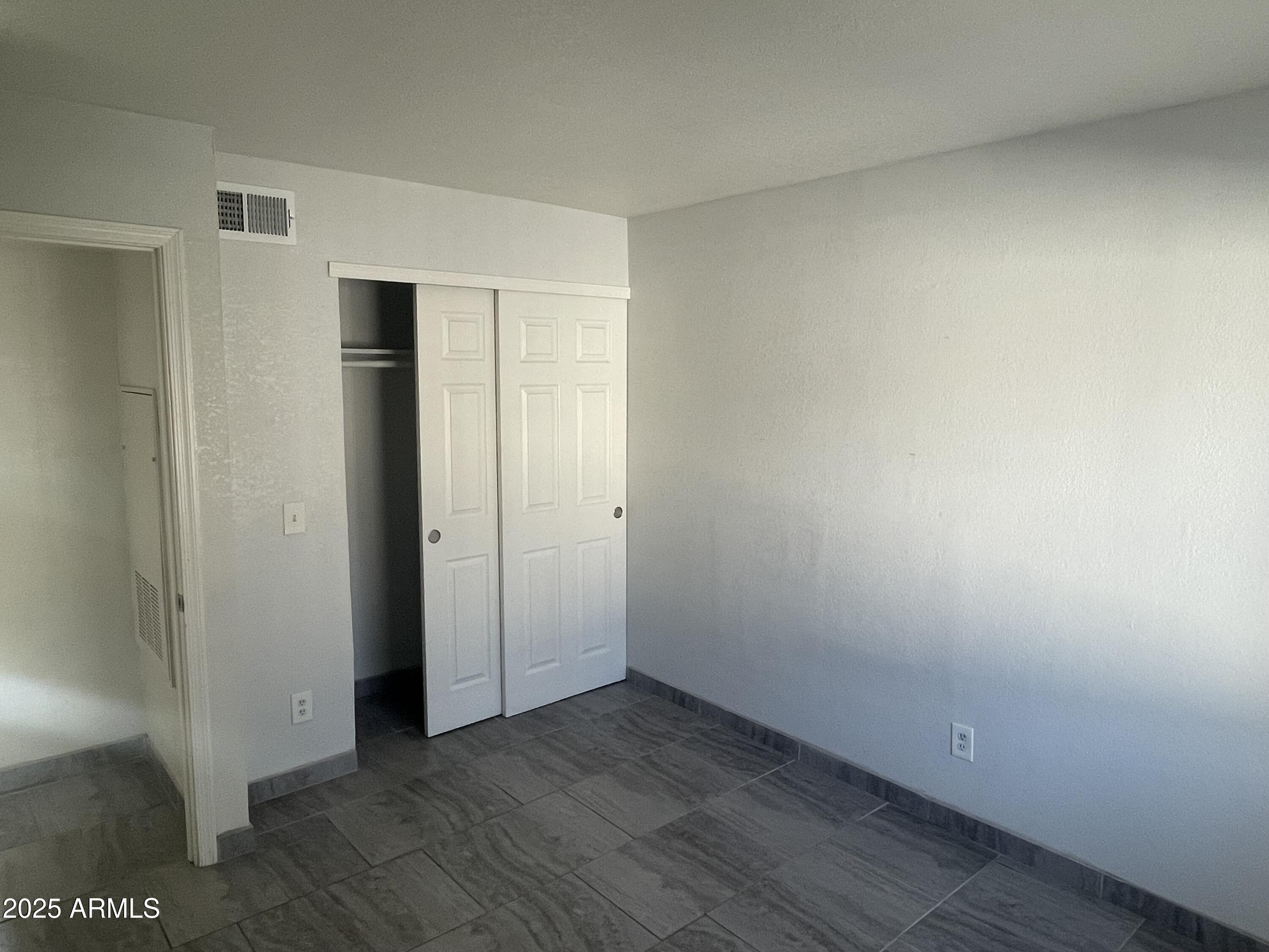 1222 East Mountain View Road, Unit 208 Phoenix, AZ 85020 - Photo 9 of 24 a view of an empty room
