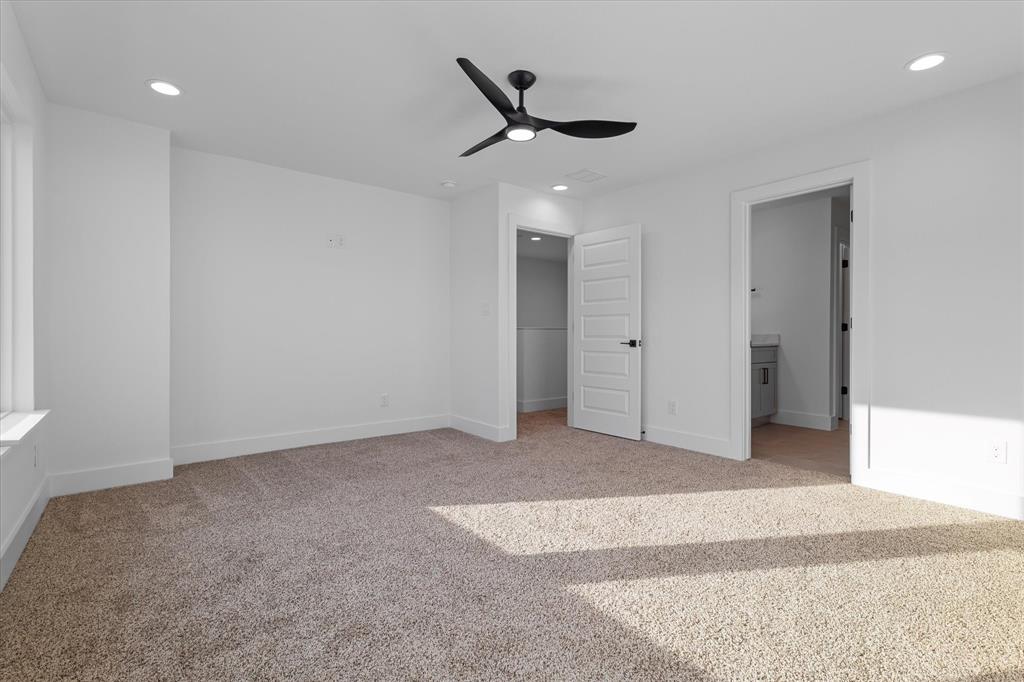 8918 Lowell Street Rowlett, TX 75089 - Photo 21 of 30 a view of a livingroom with a ceiling fan and window