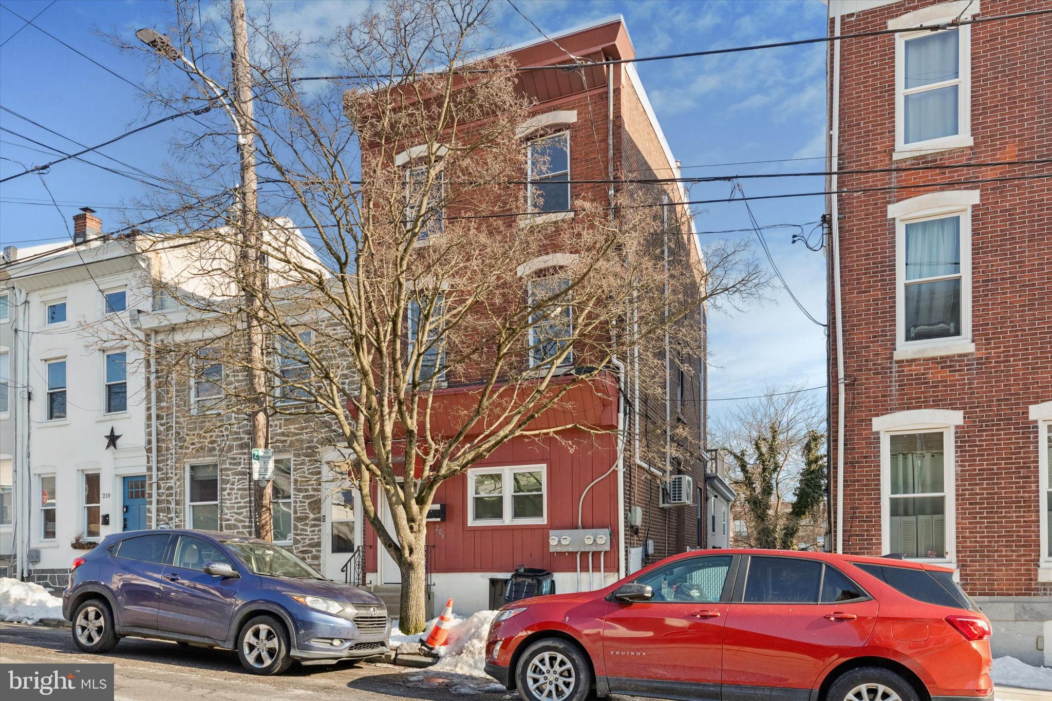 a front view of a building with parking space