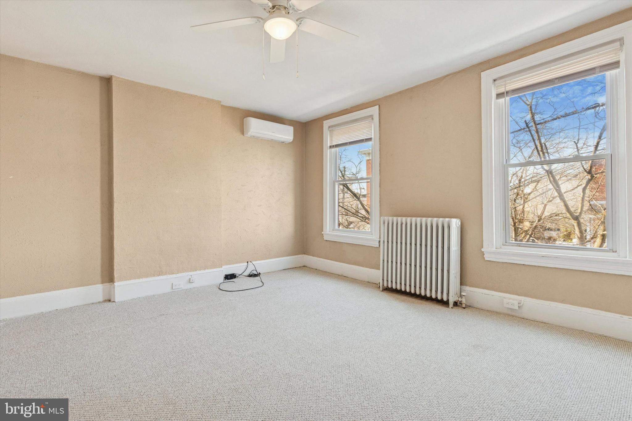 206 Ripka Street, Unit 2 Philadelphia, PA 19127 - Photo 10 of 15 an empty room with windows