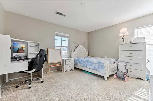 a room with a bed and furniture