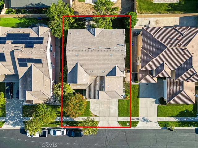 a view of a street with a palm trees