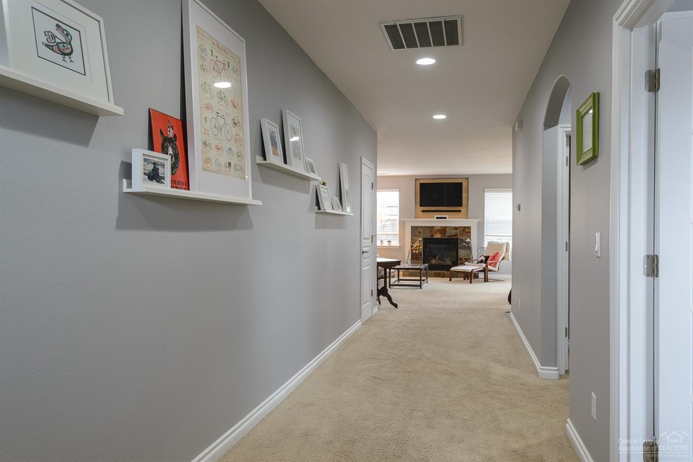 19548 Sager Loop Bend, OR 97702 - Photo 9 of 22 Expansive open hallway leads to open liv