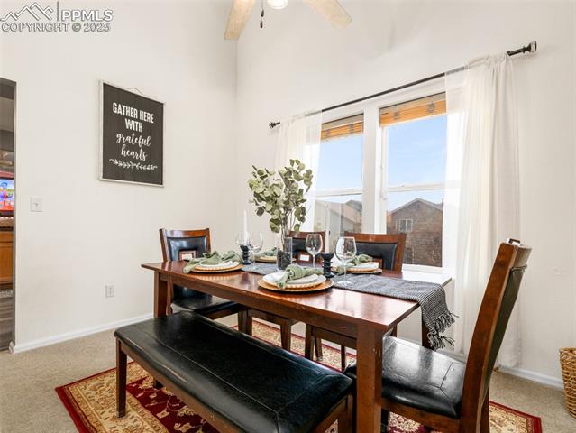 5346 Gentle Wind Road Colorado Springs, CO 80922 - Photo 6 of 28 Dining room featuring carpet flooring, ceiling fan, and baseboards