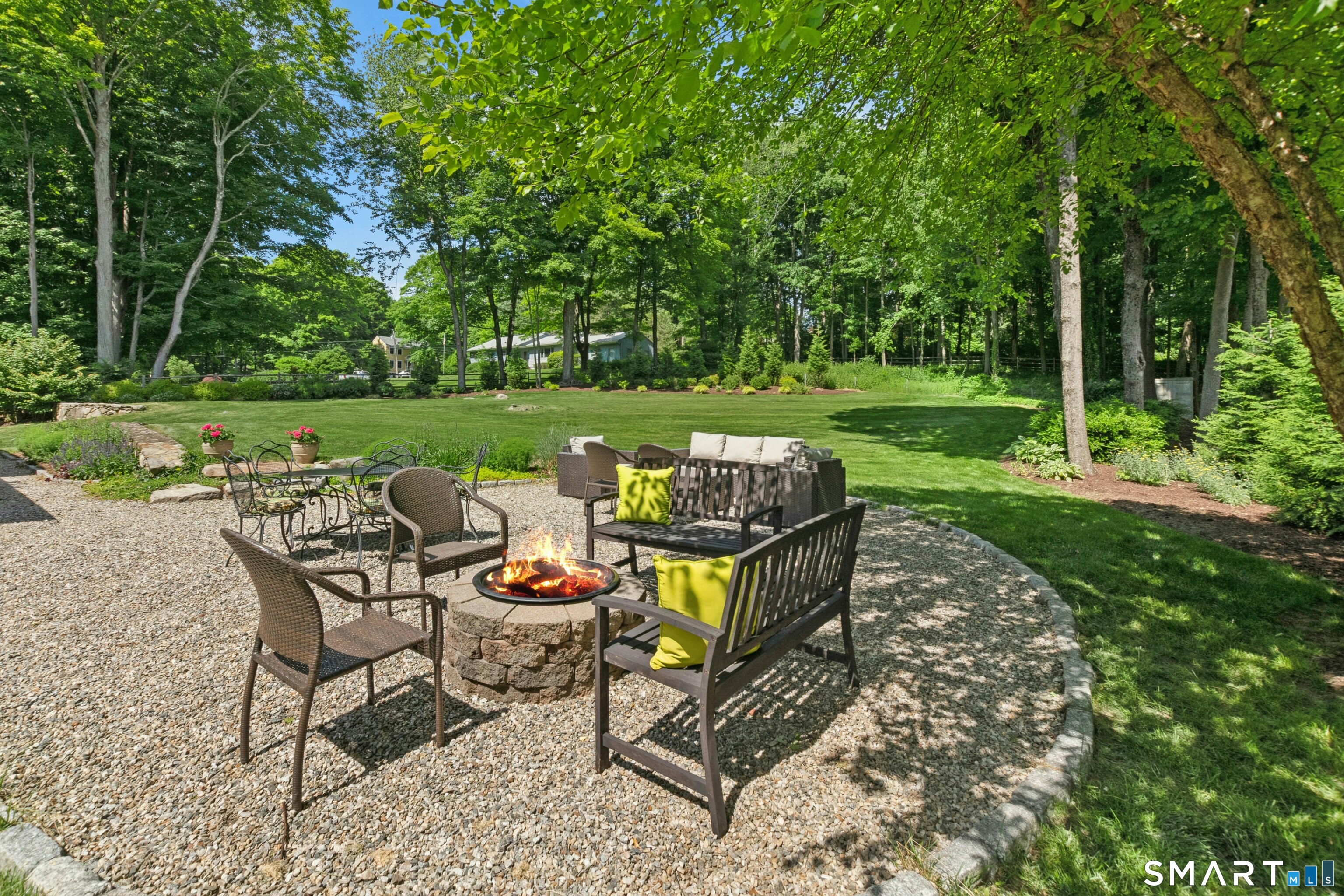 29 Old Farm Road Weston, CT 06883 - Photo 9 of 10 Enjoy sitting by the fire pit on this expansive patio with room for dining and just relaxing.