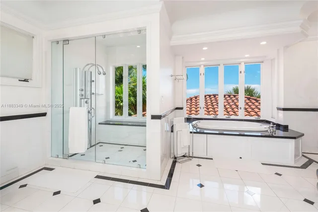 a bathroom with a tub sink and mirror