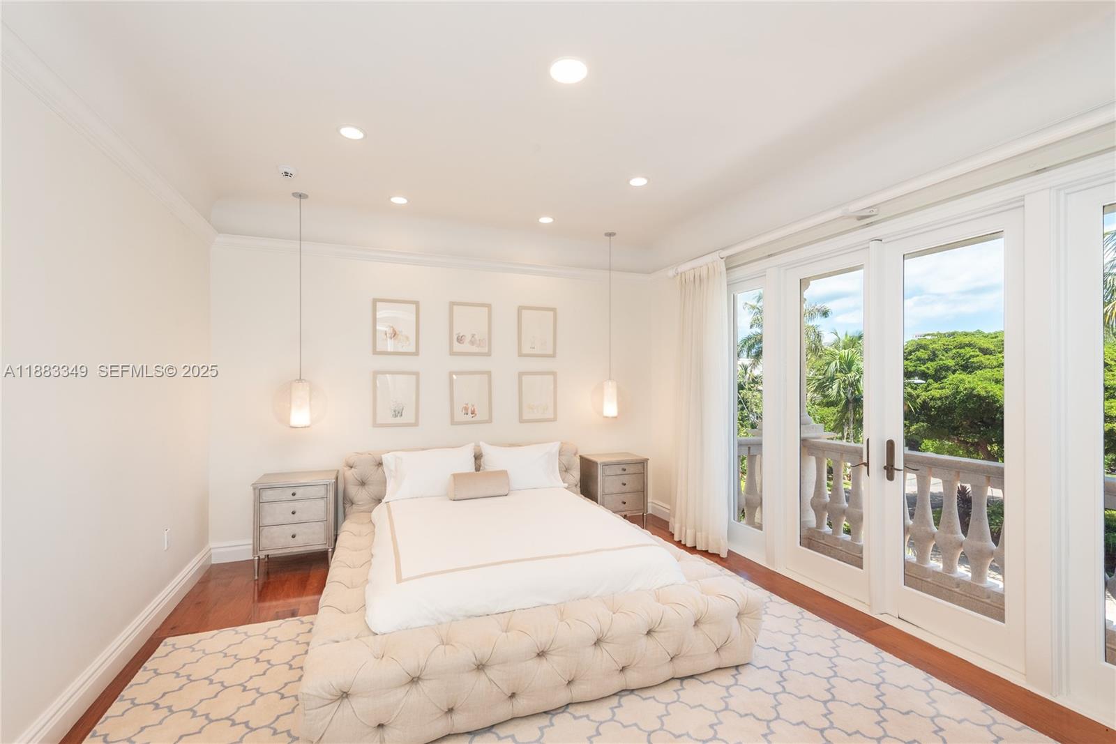 260 Cape Florida Drive Key Biscayne, FL 33149 - Photo 16 of 24 a bedroom with a large bed and a large window