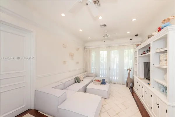 a bed room with a bed and a large window