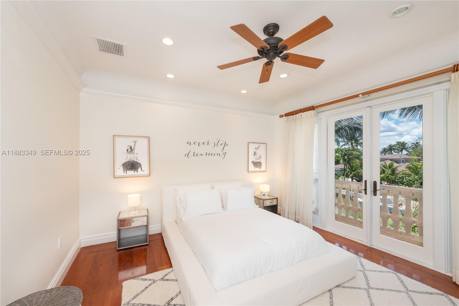 260 Cape Florida Drive Key Biscayne, FL 33149 - Photo 18 of 24 a bed room with a bed and a large window