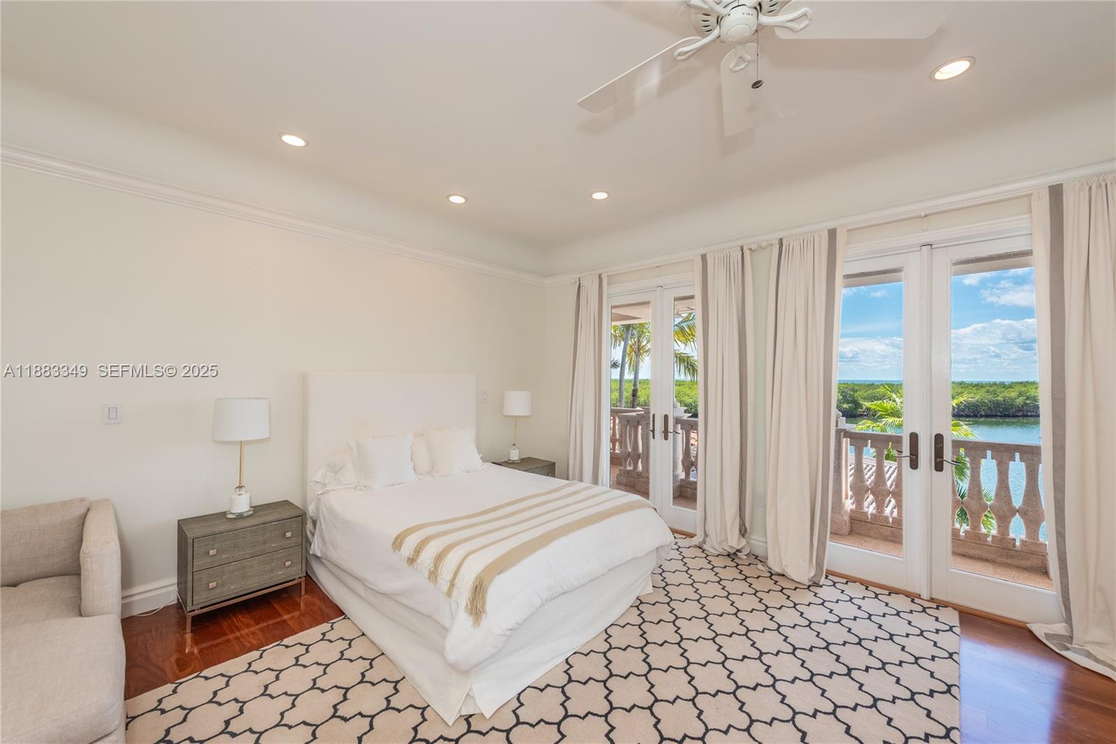 260 Cape Florida Drive Key Biscayne, FL 33149 - Photo 19 of 24 a bedroom with a bed and a large window