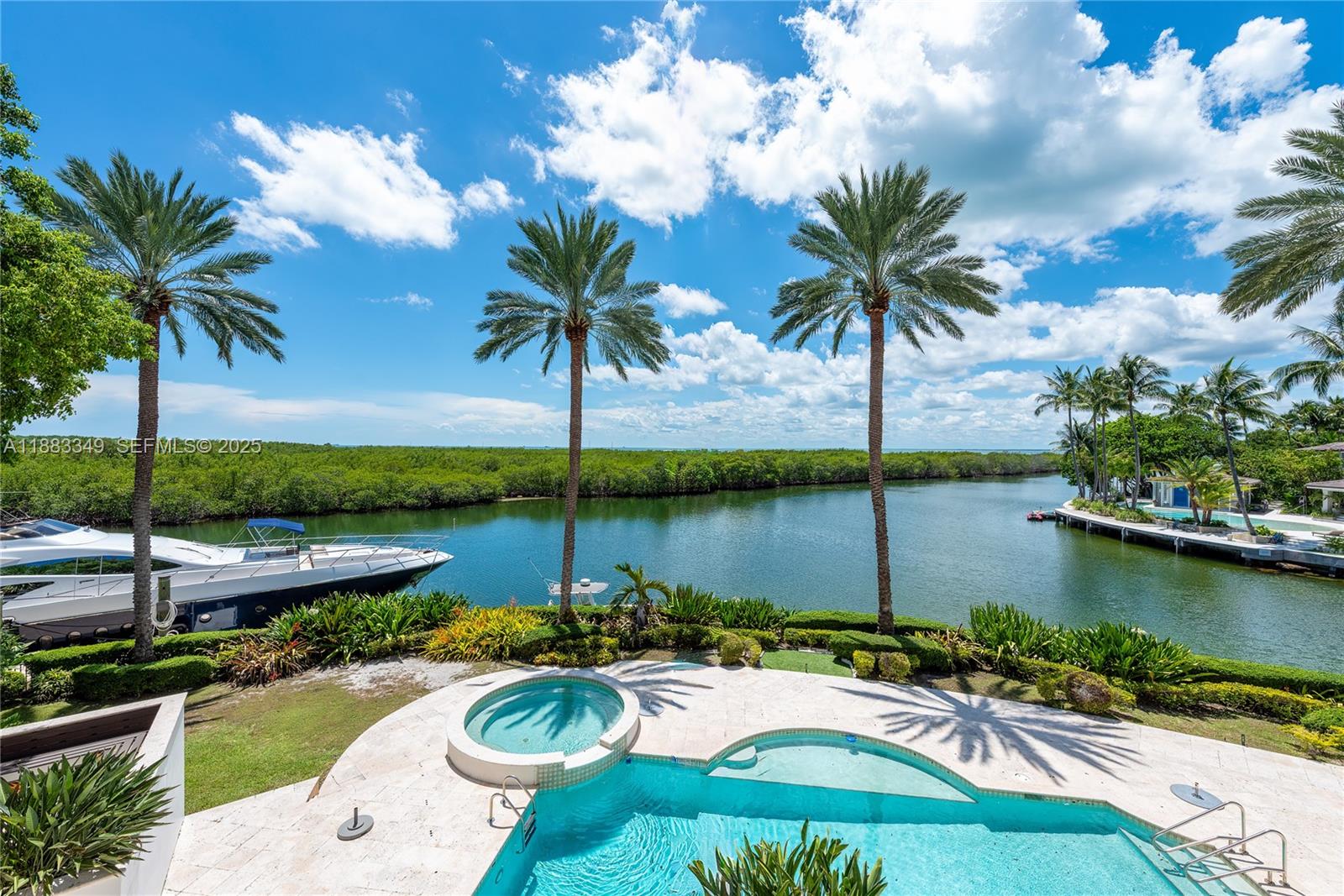 260 Cape Florida Drive Key Biscayne, FL 33149 - Photo 23 of 24 a view of a lake with a garden and lake view
