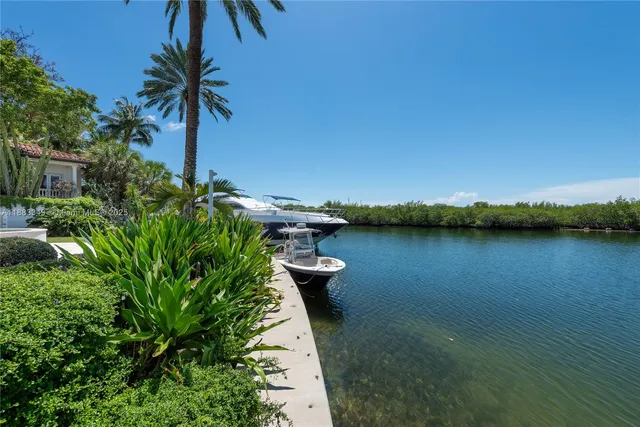 a view of a lake with a floor and potted plants