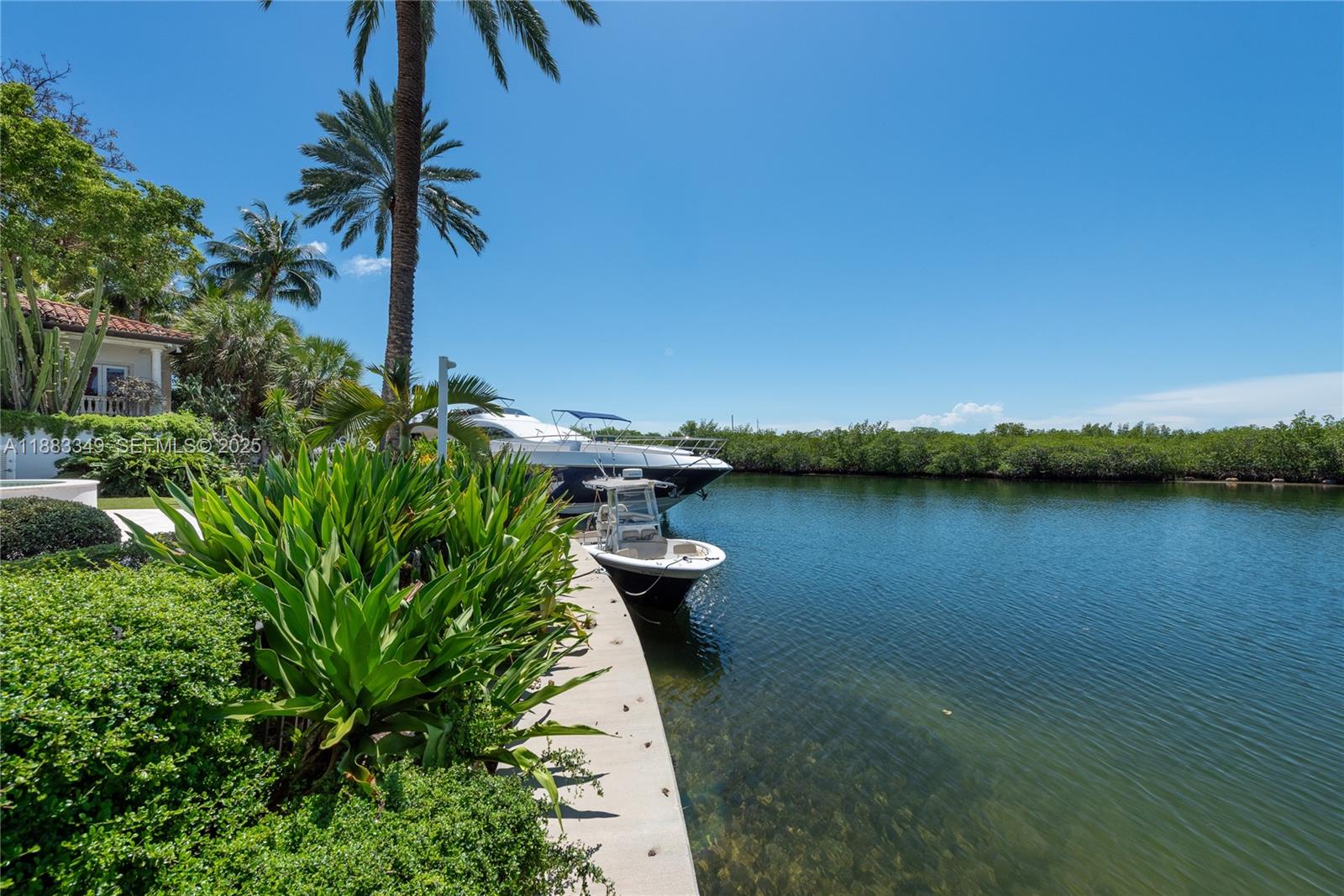 260 Cape Florida Drive Key Biscayne, FL 33149 - Photo 24 of 24 a view of a lake with a floor and potted plants
