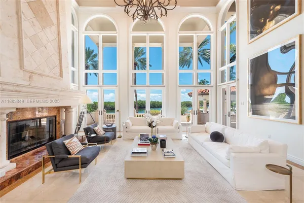 a living room with furniture fireplace and flat screen tv