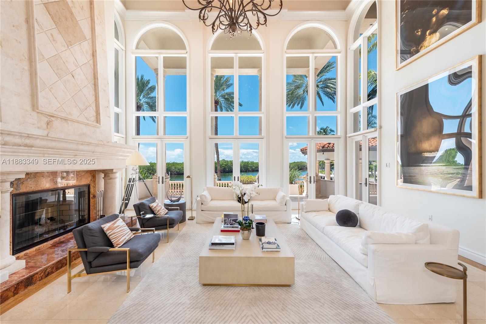 260 Cape Florida Drive Key Biscayne, FL 33149 - Photo 4 of 24 a living room with furniture fireplace and flat screen tv