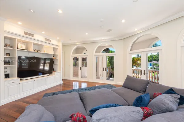 a living room with furniture tv and a fireplace