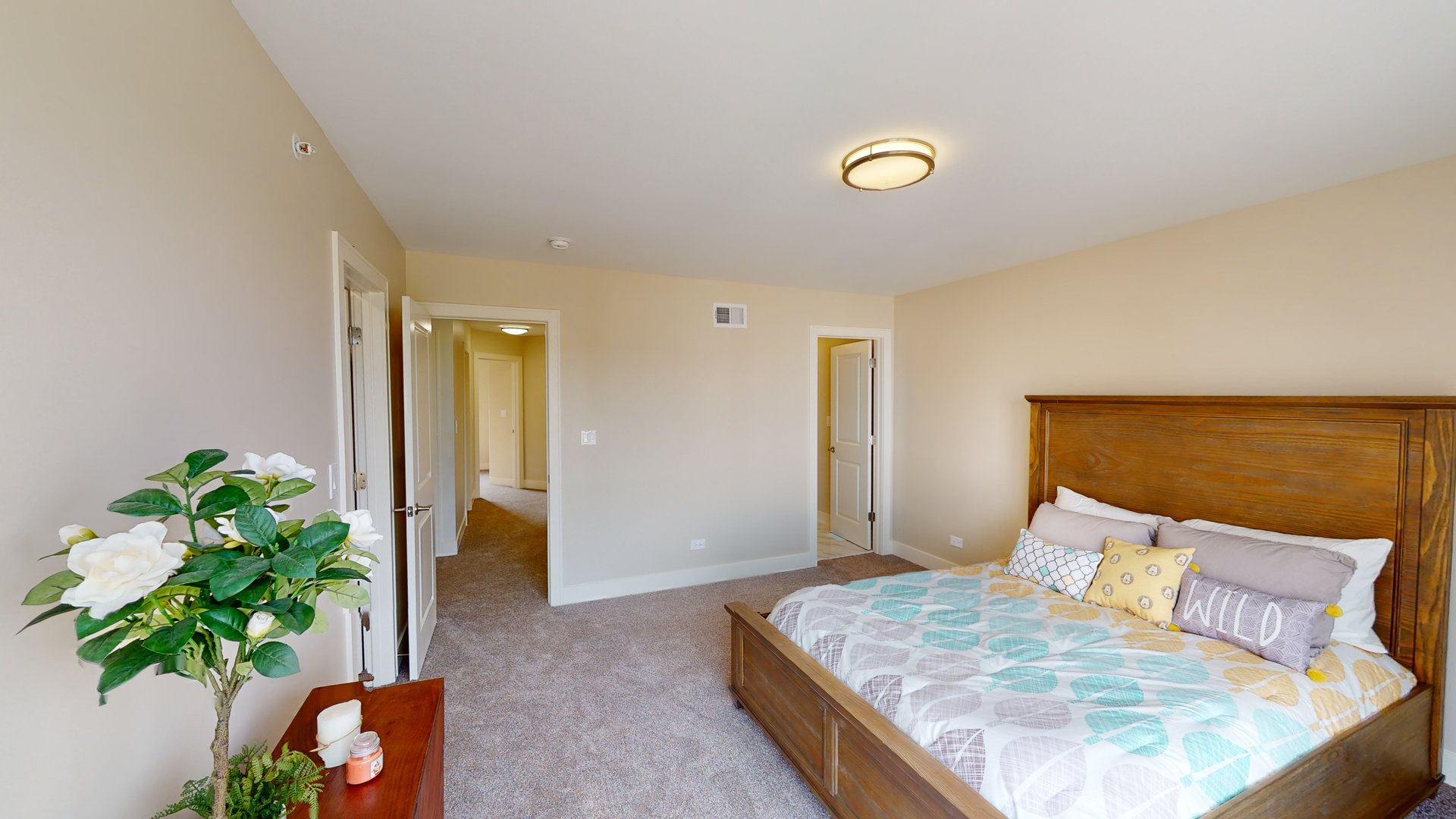 521 Highlands Parkway Itasca, IL 60143 - Photo 15 of 22 a bedroom with a bed and a potted plant