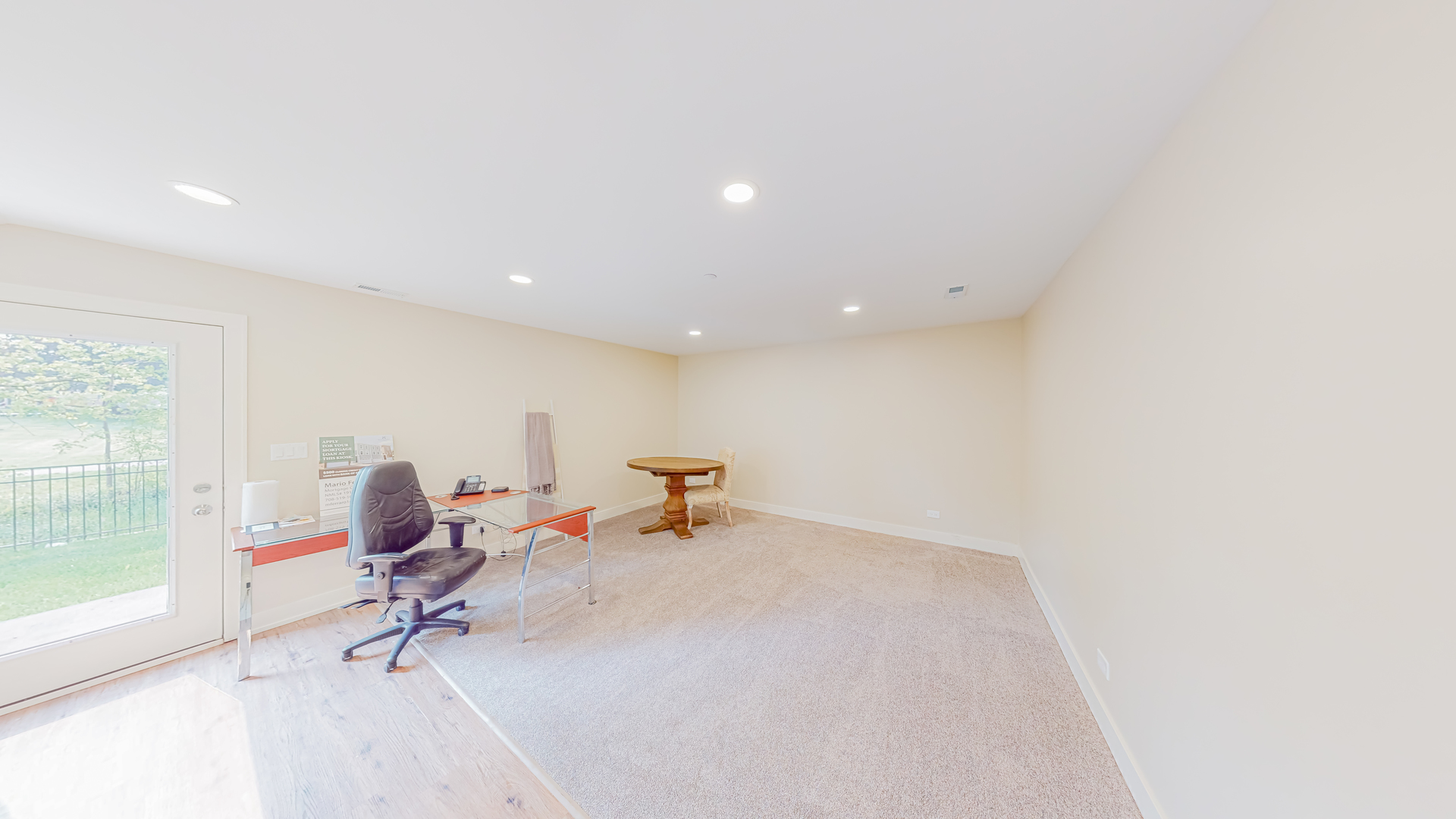 521 Highlands Parkway Itasca, IL 60143 - Photo 18 of 22 a living room with furniture a flat screen tv and a floor to ceiling window