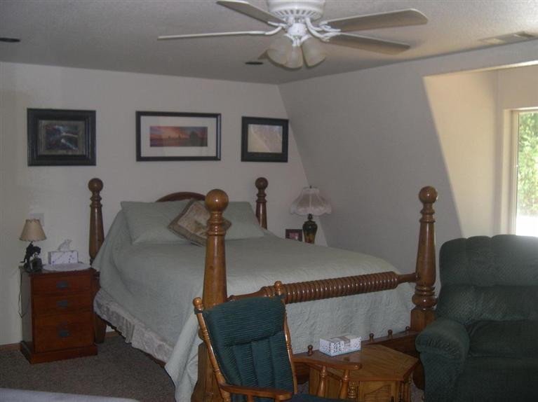 9237 Holland Loop Road Cave Junction, OR 97523 - Photo 15 of 25 a view of a dining room with furniture and a chandelier