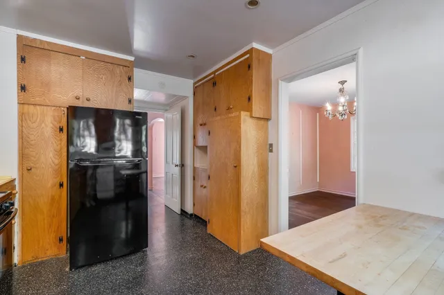 a kitchen with stainless steel appliances granite countertop a sink stove and wooden floor