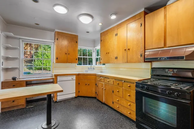 a view of an entryway with wooden floor and door