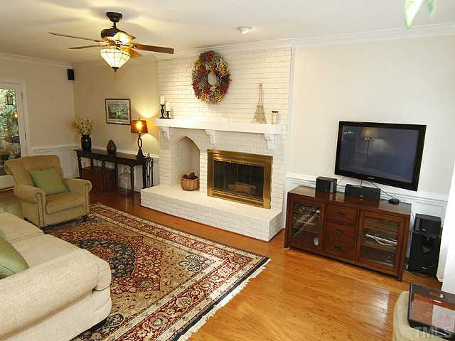 7908 Farnham Court Raleigh, NC 27615 - Photo 4 of 25 Fabuous Spacious Family Room with Brick Fireplace and Wood Box. Warm Hardwood Floors - Chairrail - Wainscoat Offer Additonal Detail for the Most Critical Eye. Den/Family/Great Room