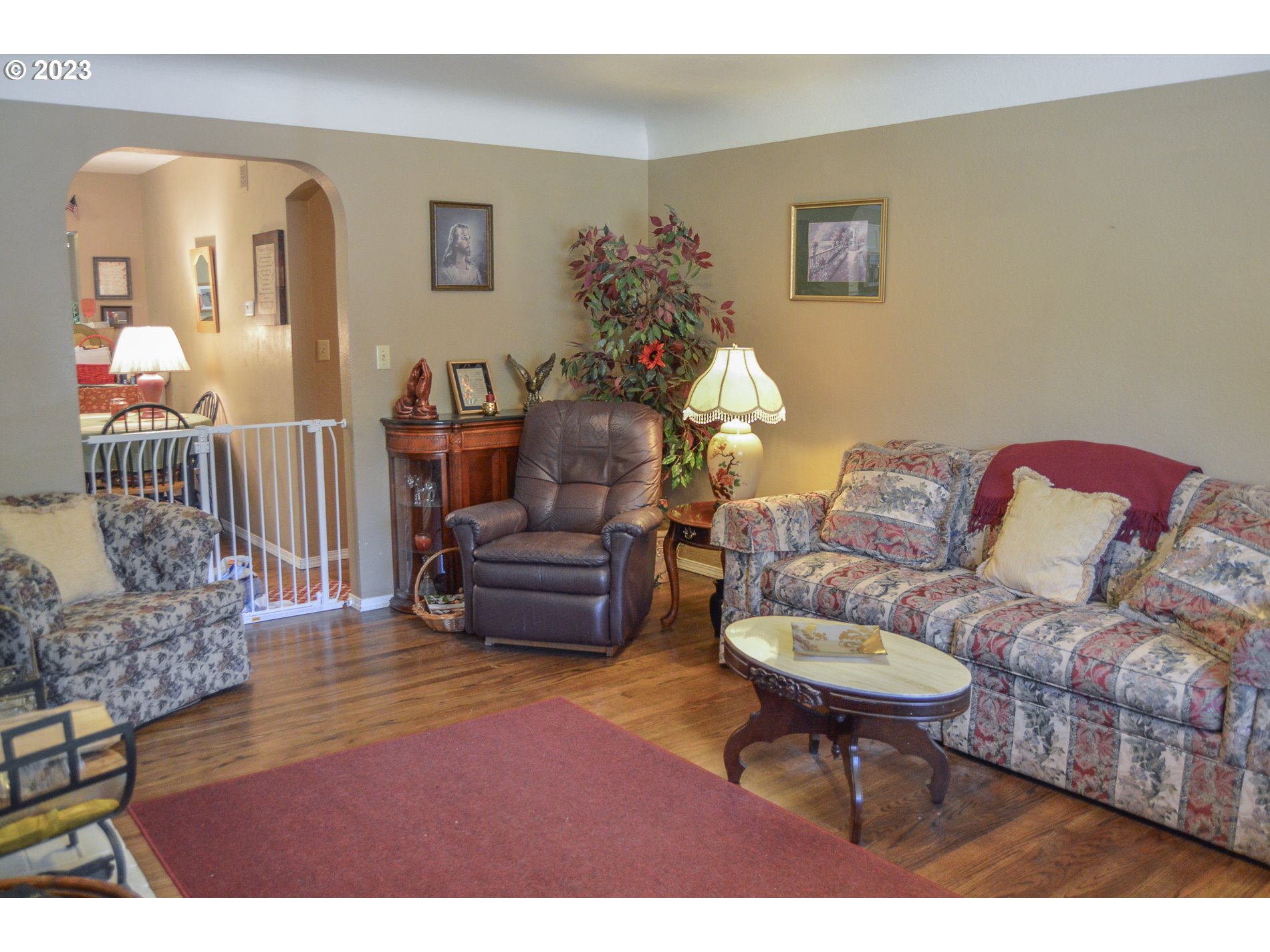 367 Hayden Bridge Way Springfield, OR 97477 - Photo 4 of 16 a living room with furniture a piano and a bookshelf