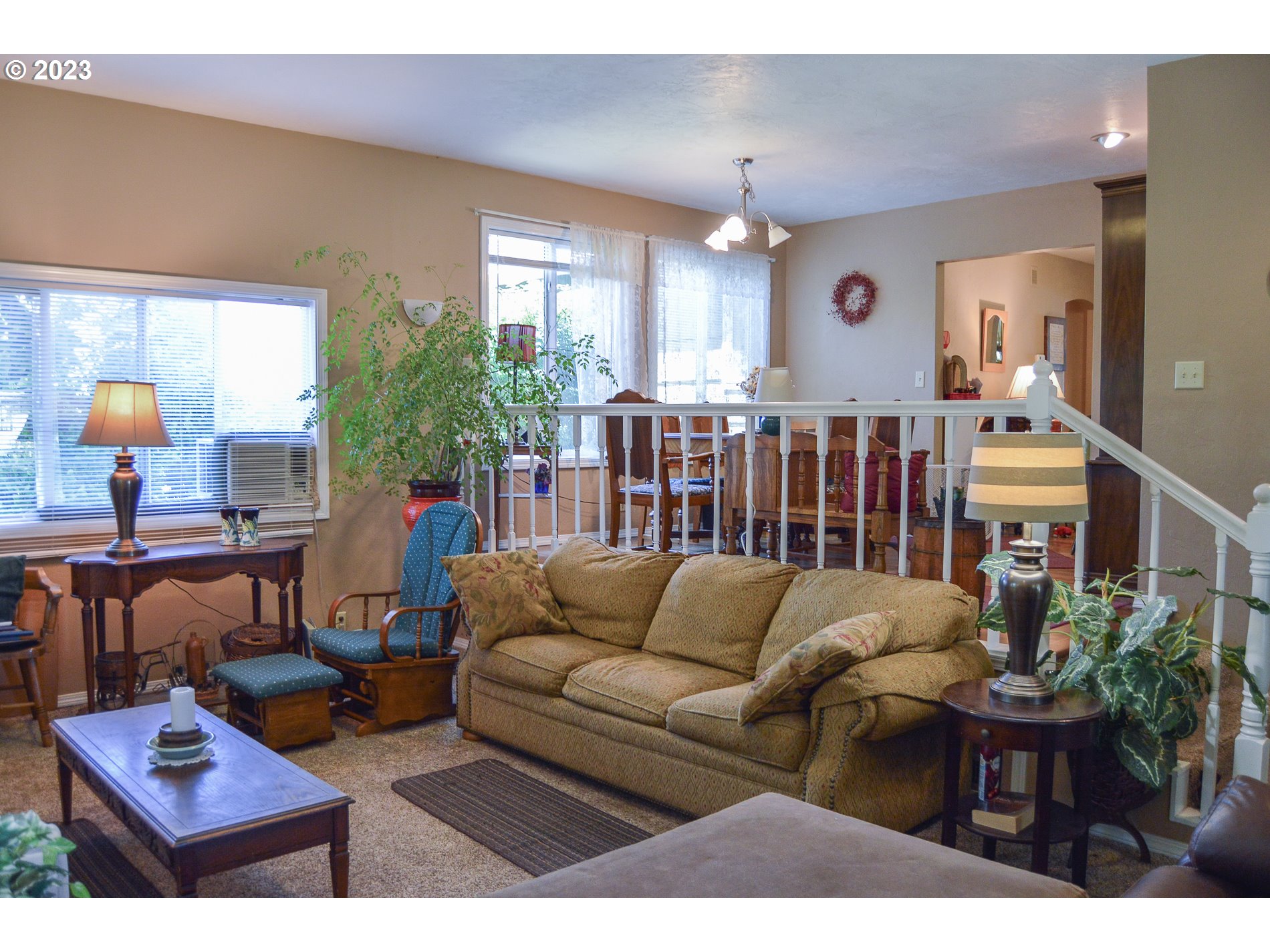 367 Hayden Bridge Way Springfield, OR 97477 - Photo 7 of 16 a living room with furniture potted plant and a window