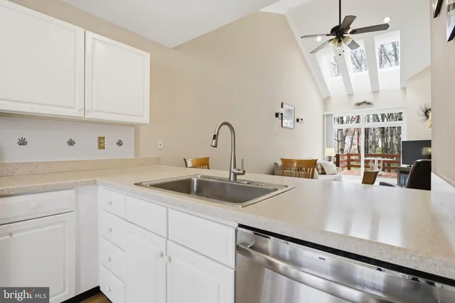 a kitchen with cabinets a sink and appliances