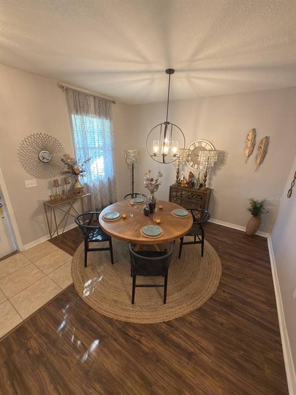 1277 Seburn Road Apopka, FL 32703 - Photo 7 of 28 a view of a dining room with furniture window and wooden floor
