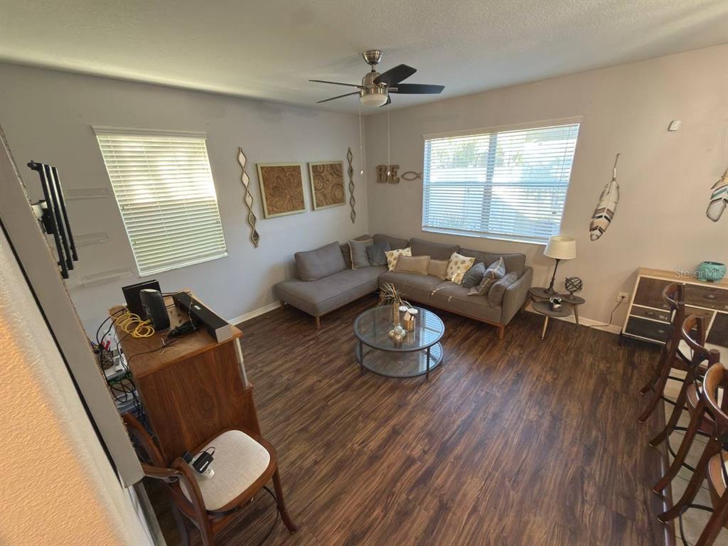 1277 Seburn Road Apopka, FL 32703 - Photo 8 of 28 a living room with furniture and wooden floor