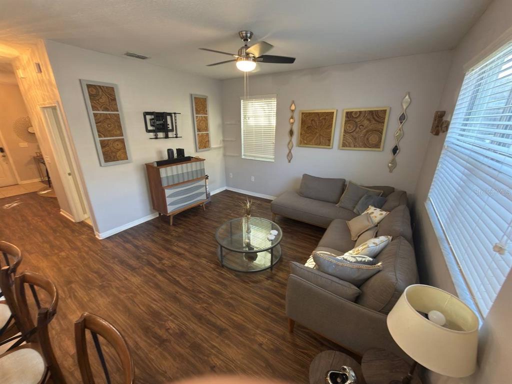 1277 Seburn Road Apopka, FL 32703 - Photo 9 of 28 a living room with furniture and wooden floor